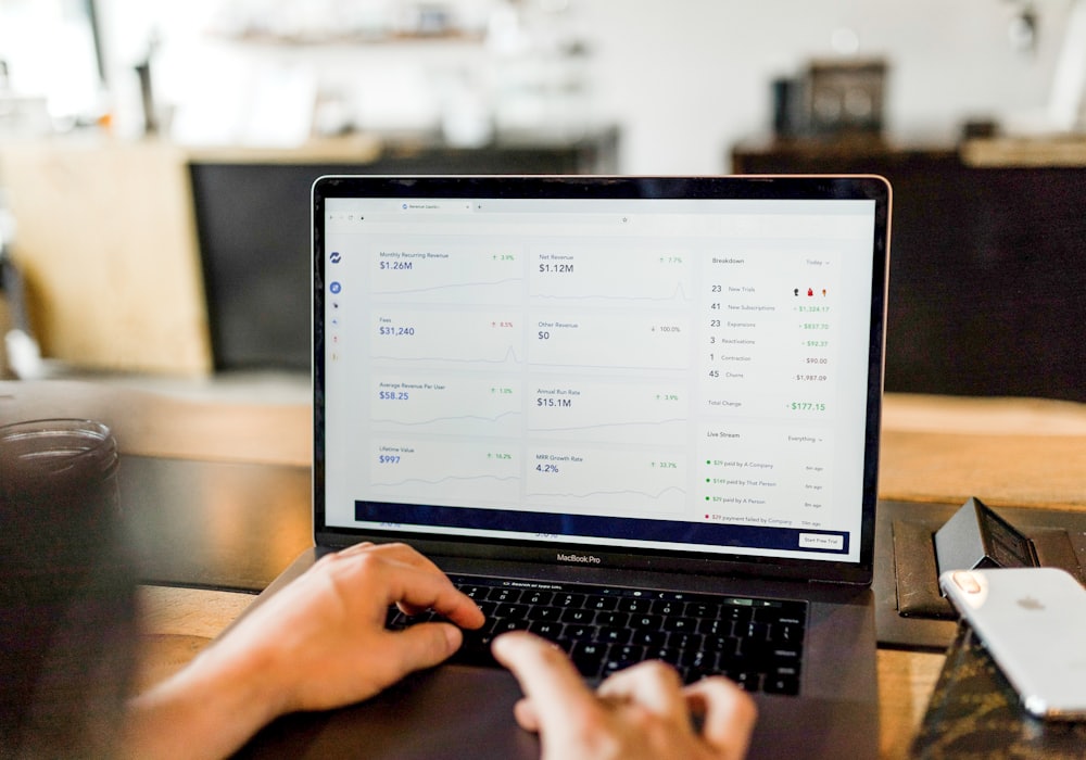 An account manager reviewing Seller Central performance metrics on a large display.